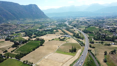 aerial view of a valley with highway and farmland