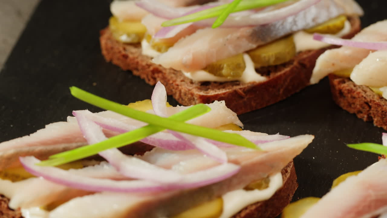 Appetizer Sandwiches with Smoked Fish, Pickled Vegetables, and Onion
