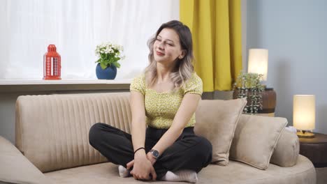 emotional young woman watching outside the window.