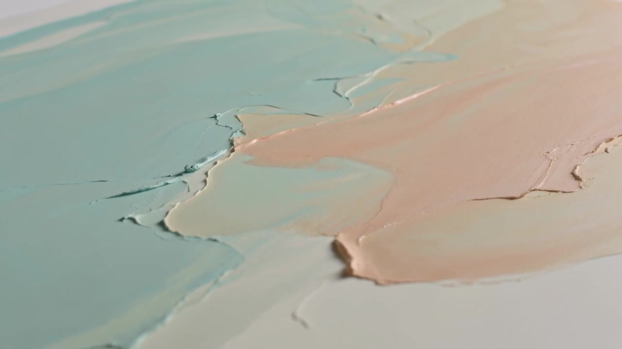 Revealing teal and peach paint swaths with camera shifting focus on white support, exposing ridges