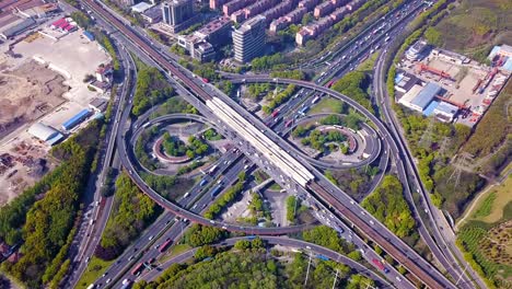 aerial view of highway junctions with roundabout. bridge roads shape circle in structure of architecture and transportation concept. top view. urban city, shanghai, china.