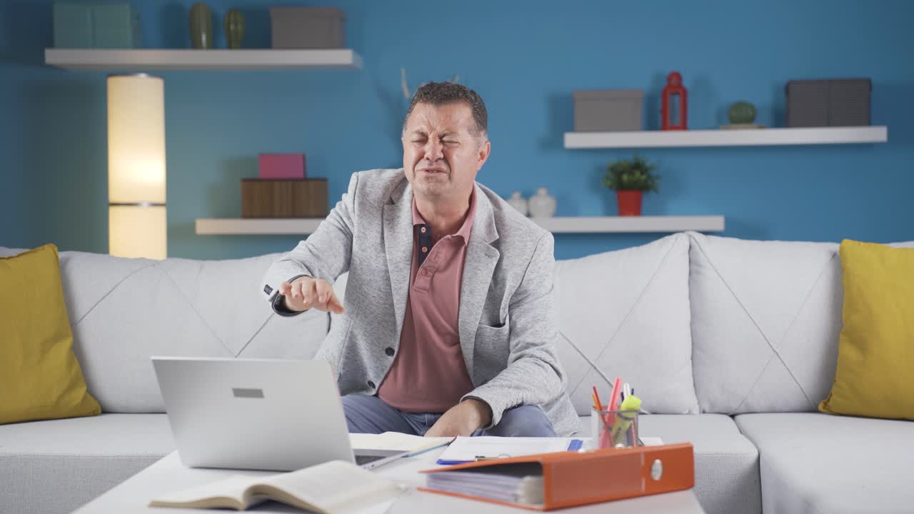 Home office worker man has fatigue.