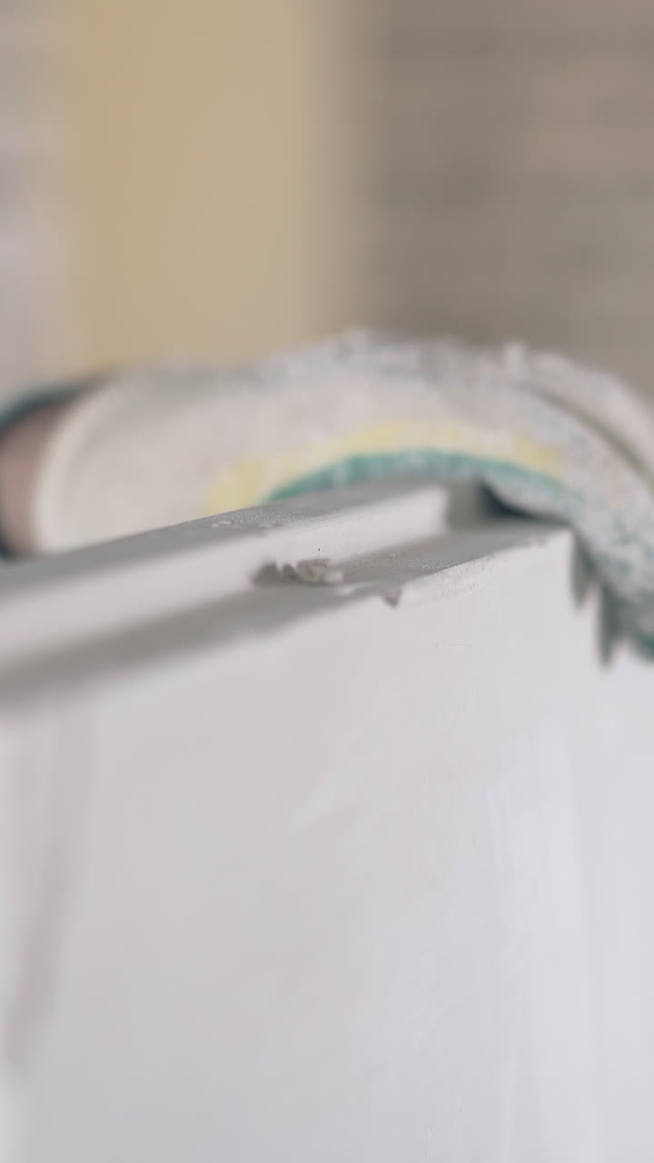 professional worker in special gloves holds large grey gypsum pasteboard construction with hand close view