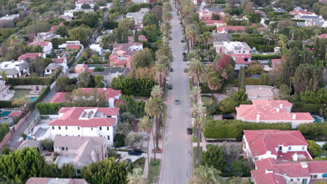 smooth aerial shot of beverly hills suburbs with hollywood hills in the background