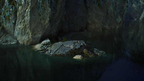 rocky cliffs in the ocean at sunny day