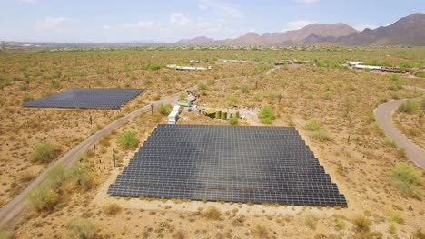 aerial descent on solar panels array panels in the sonoran desert near taliesin west, scottsdale, arizona concept: environment, alternative energy, solar power