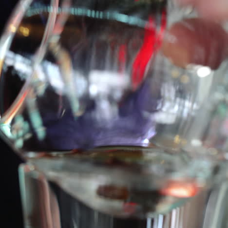 Bartender prepares Sambuca at the bar. Mixing of alcoholic drinks. Sqare video