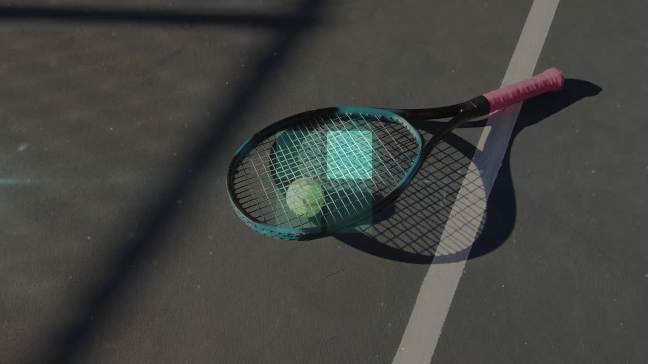 Overhead flat design showing turquoise tennis racket holding neon yellow tennis ball on green court