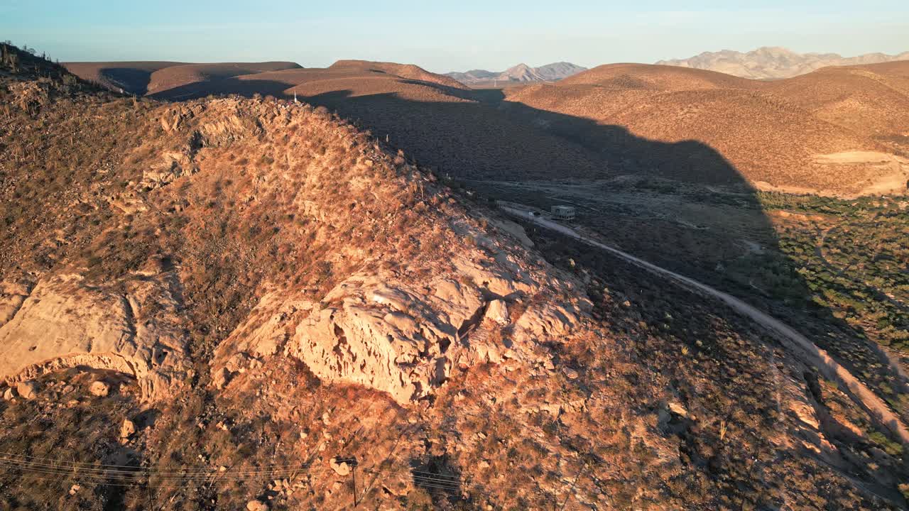 Rocky terrain and desert landscape near la paz, mexico, during golden hour, aerial view