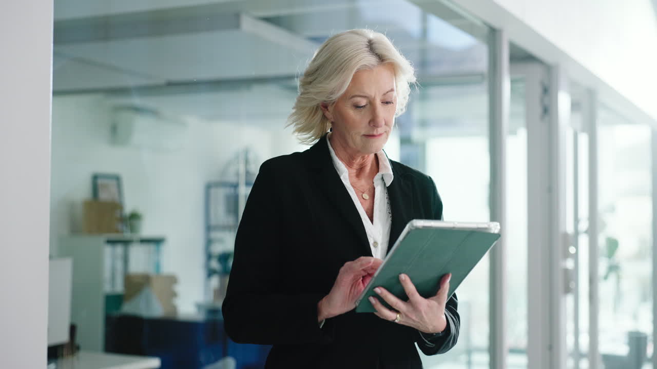 Businesswoman Using Tablet in Office