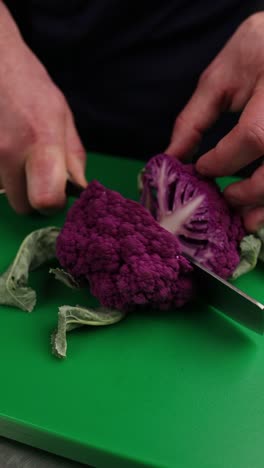 cutting purple cauliflower