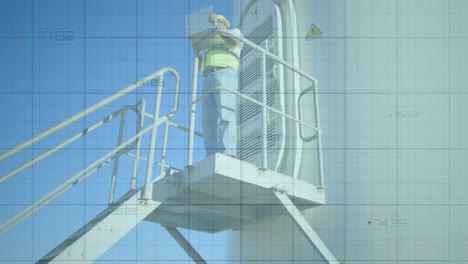 engineer on platform with wind turbine, data analysis animation over blue grid