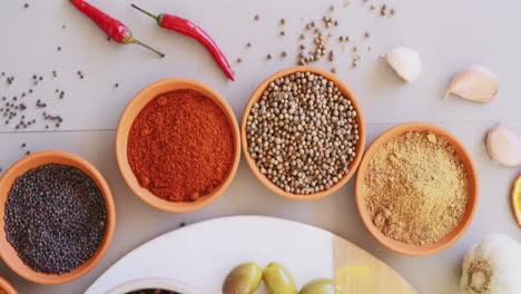 a variety of spices on a table in studio