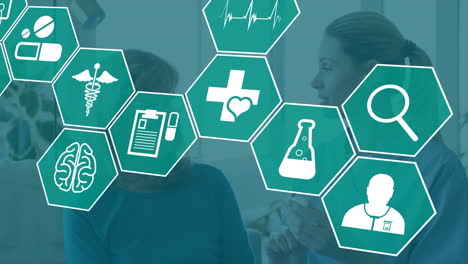 animación de iconos médicos sobre una doctora y una paciente caucásicas