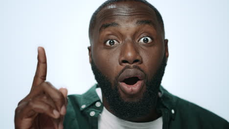 Portrait-of-african-american-man-thinking-idea-on-light-background-in-studio.