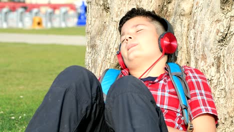 preteen boy relaxing under sun