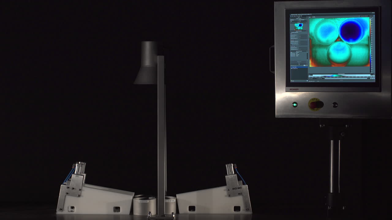 Wide shot of a science exhibit, a device is showcasing the different temperature change, through time, in different liquid solutions