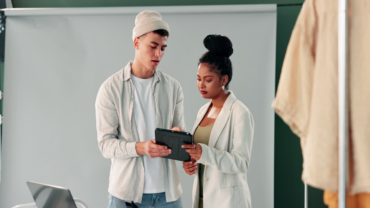 Fashion designers discussing garment details