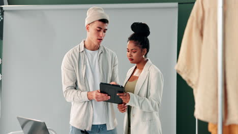 fashion designers discussing garment details