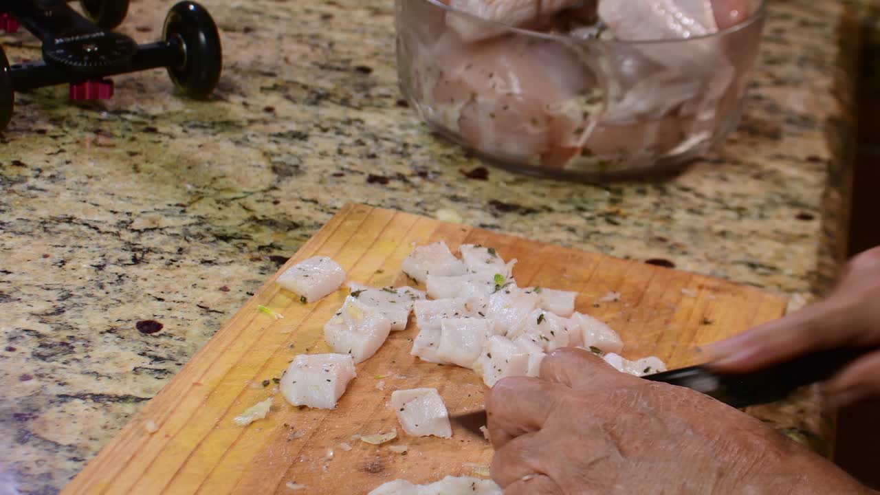 Filming a kitchen scene of woman chef hands chopping chicken with Osmo Pocket on a slider, capturing smooth cinematic movement