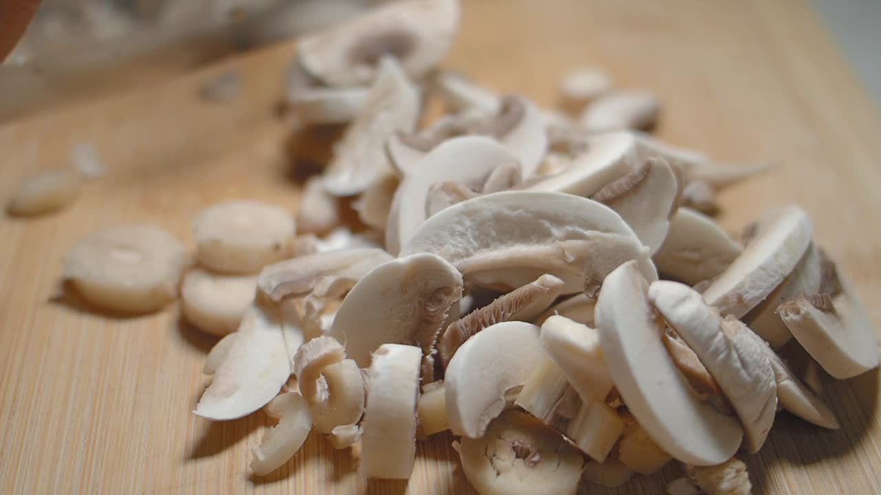 Sliced Mushrooms on a Cutting Board