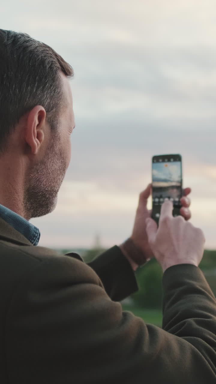 Man taking a photo with his phone