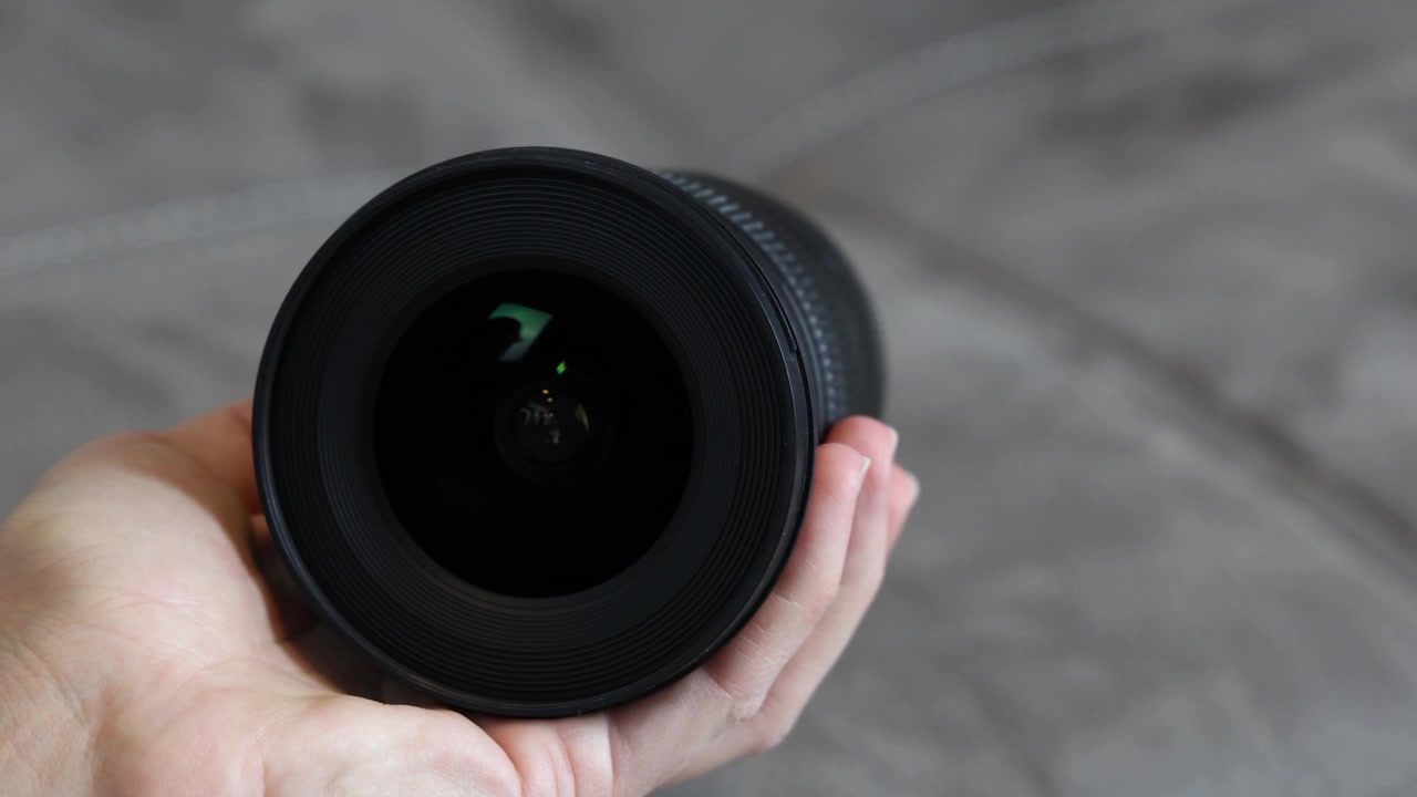 Professional camera lens, front and side view isolated