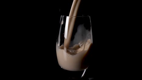 delicious creamy hazelnut milk poured into a glass in slow motion