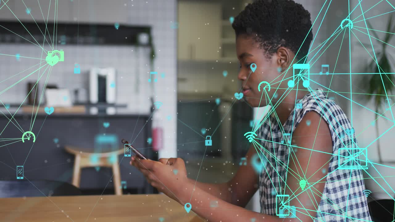 Animation of network of connections with icons over african american woman using smartphone