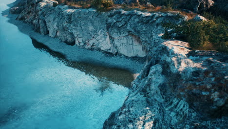 serene river landscape: stunning view of blue water and rocky cliffs