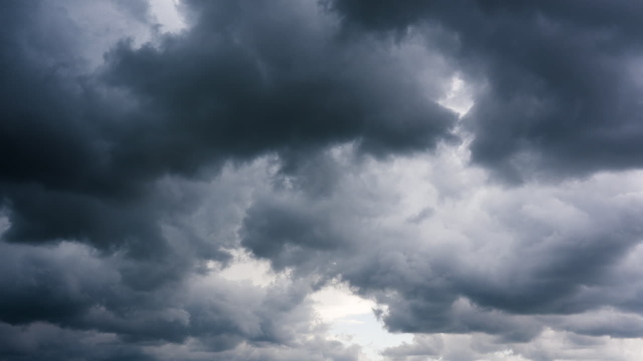 Just Clouds Drifting Above As Rain Starts To Fall