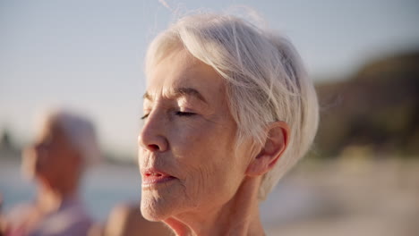 Beach-yoga,-face-or-old-woman-breathing