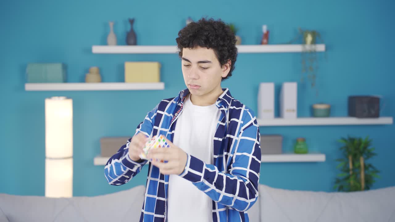 The boy who can't make the intelligence cube is thoughtful.
