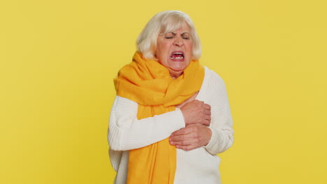 stressed sick senior woman suffers from tension holding chest with heart pain attack risk of stroke
