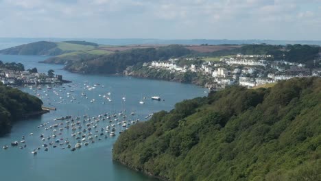 aerial reveal of the coastal cornish town of fowey, on the river fowey in cornwall, uk