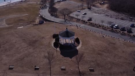 circling over the pavilion at stage fort park in gloucester, massachusetts