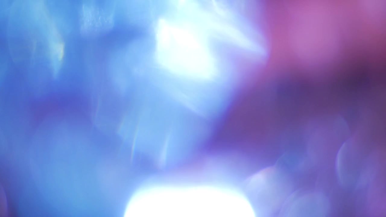 Dynamic Blue and Purple Light Leaks and Bokeh Transition