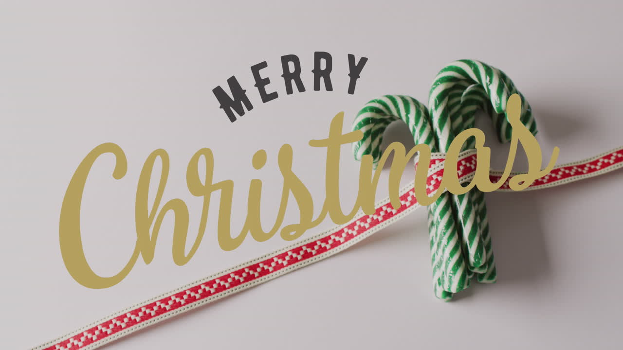 animación de saludos de navidad texto sobre las decoraciones de los caramelos de navidad.