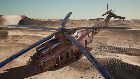 old rusted military helicopter in the desert at sunset