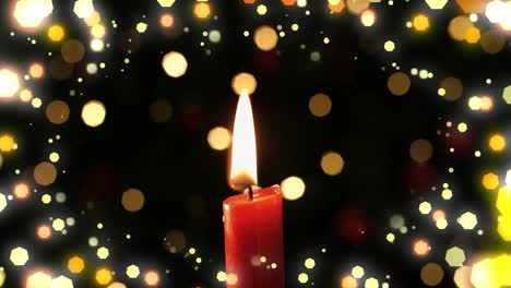 animación de la vela roja de navidad y las luces de hadas parpadeando sobre un fondo negro.