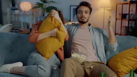 couple watching a scary movie