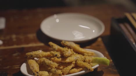 Fried-Shrimp-on-Table,-Close-Focus-Shot-Tilt-Up