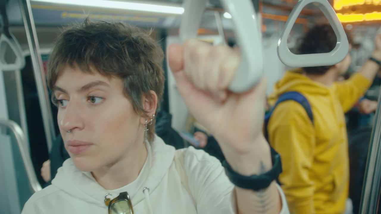 Pensive Woman Riding Subway