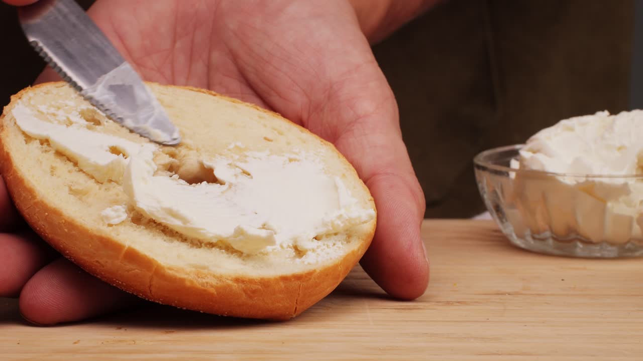 Bagel sandwich brunch, lunch plate of a bagel with smoked salmon and cream cheese and ham, close up morning cafe menu.