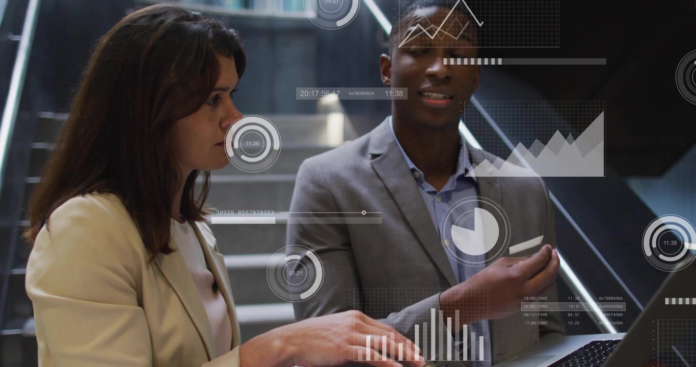 Team on stairs woman tapping laptop activating overlays reviewing analytics while man checking cell