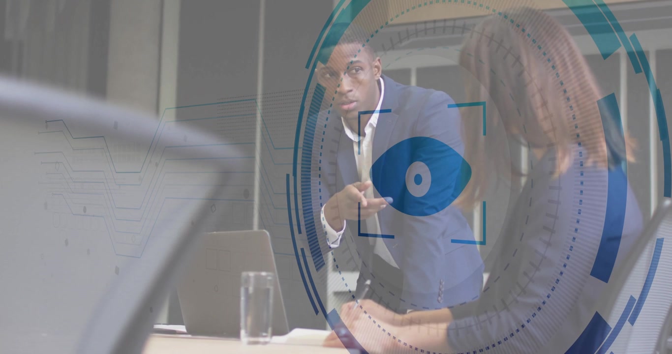 Male presenter stepping toward colleague, activating animated eye icon overlay in business meeting