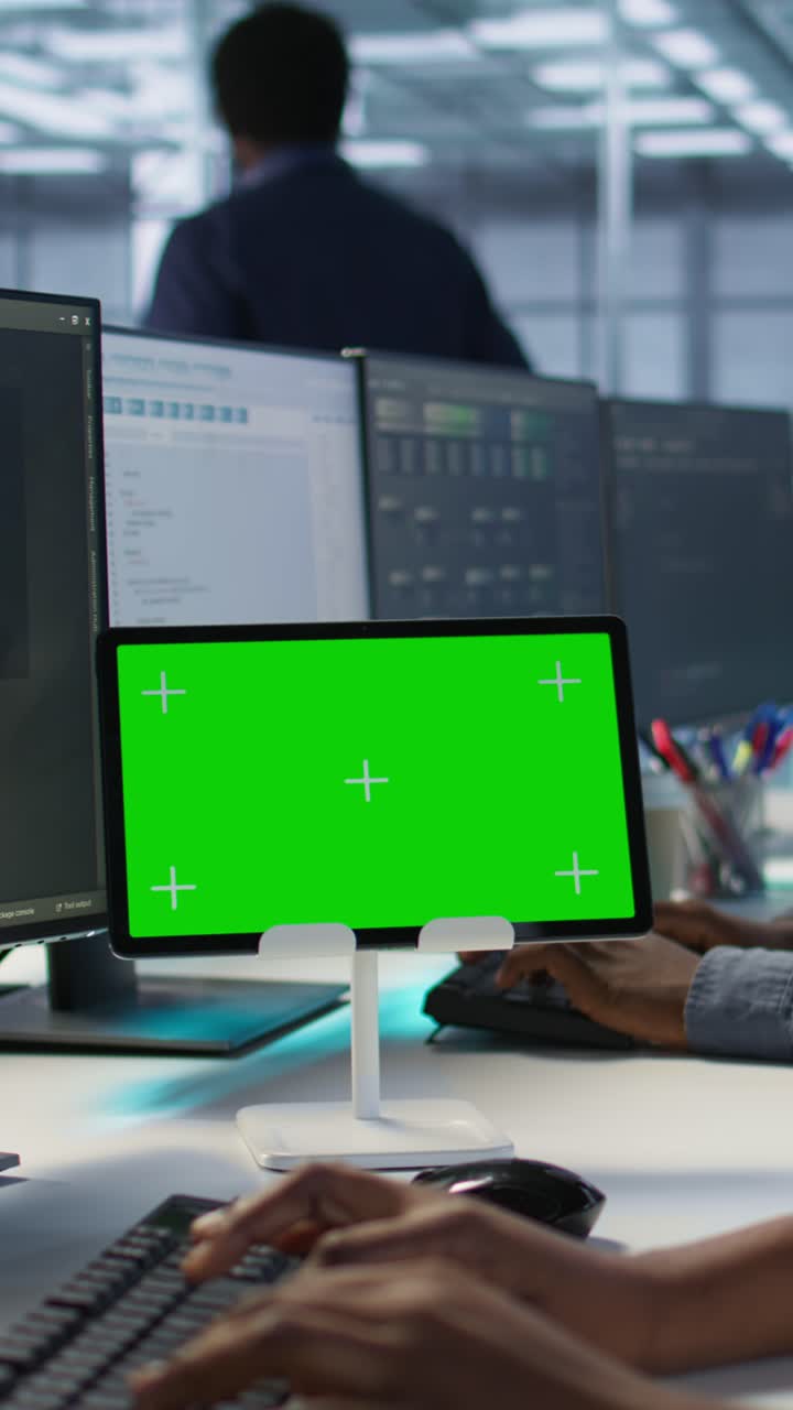 Vertical video Data center software developers using chroma key tablet