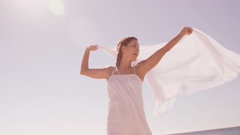 woman smiling with a sheet