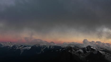 view of the caucasus range as the sun sets upon them