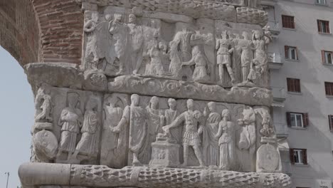 close establishing of carved reliefs on arch of galerius in thessaloniki, greece, historic detail
